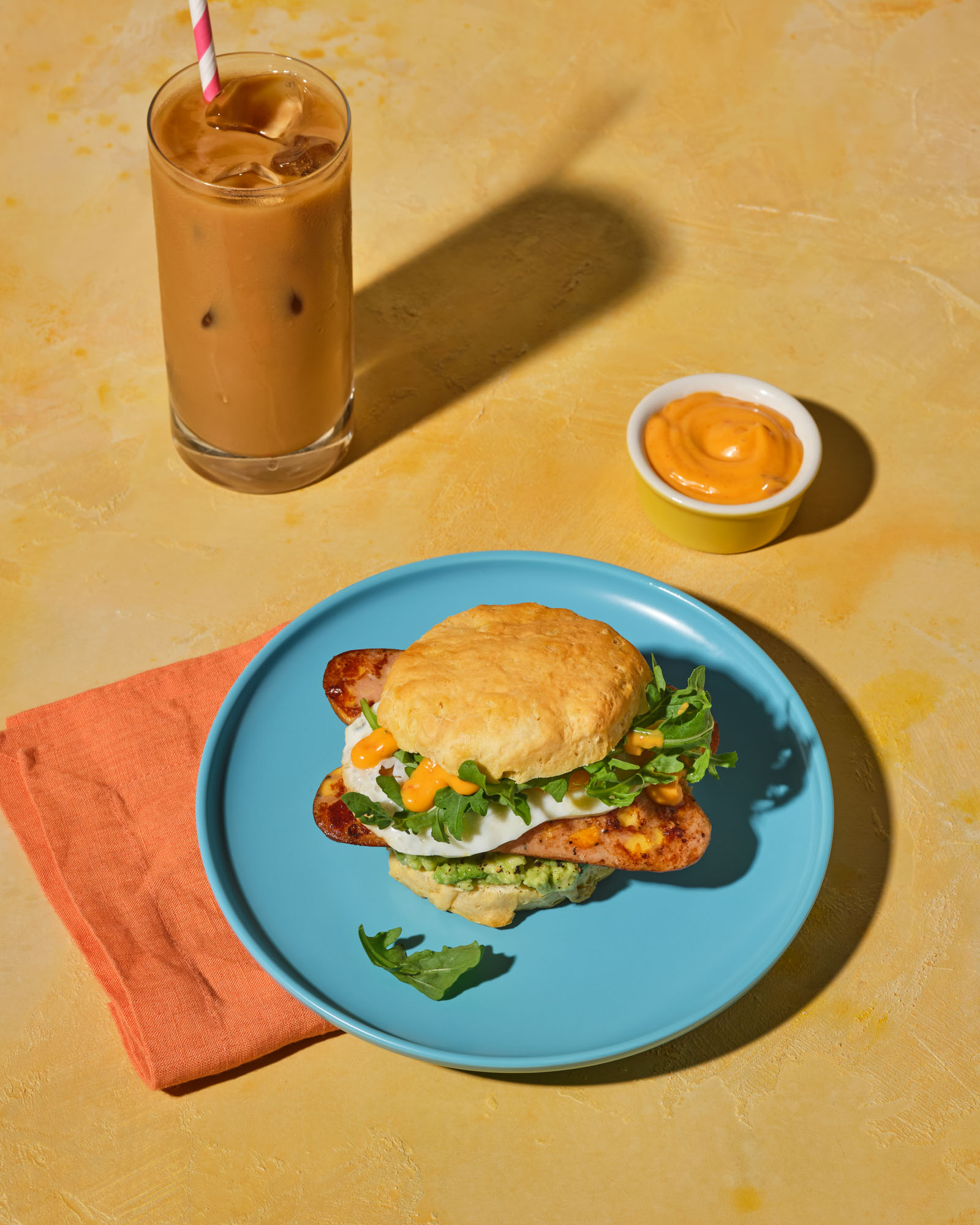 A biscuit breakfast sandwich made with The Sausage Project's Melty Cheddar Chicken Sausage.