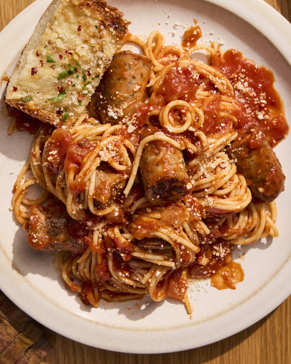 A heaping plate of spaghetti, marinara, and Italian Herb Chicken Sausage.