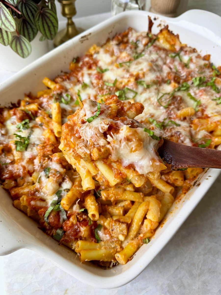 A baking dish full of cheesy baked ziti loaded with Italian Herb Chicken Sausage.