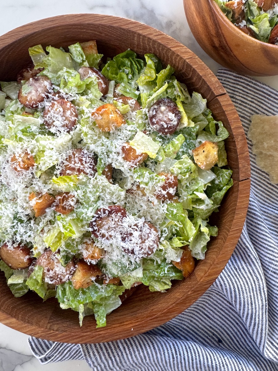 A crispy, creamy Caesar salad with crispy Classic Roasted Chicken Sausage coins.