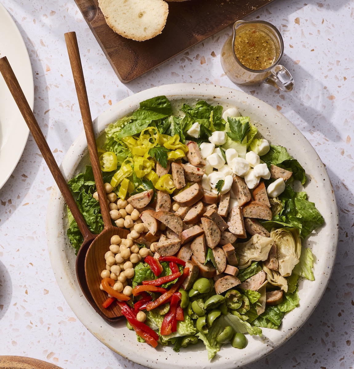 An antipasto salad featuring Classic Roasted Chicken Salad.