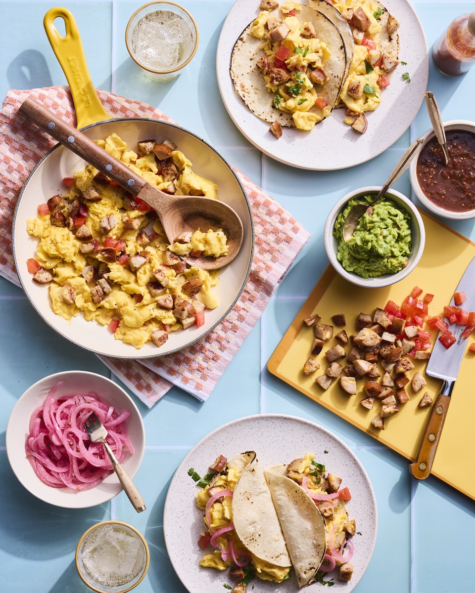 A table topped with chicken sausage breakfast taco fillings